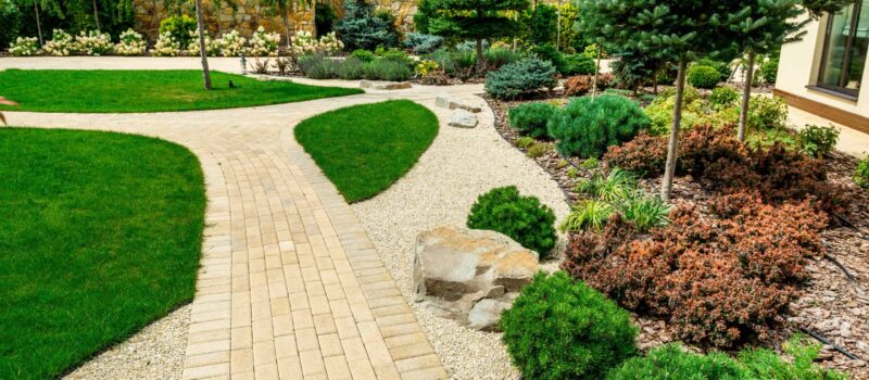 A country house with a beautiful courtyard behind the house and a swimming pool, landscape design